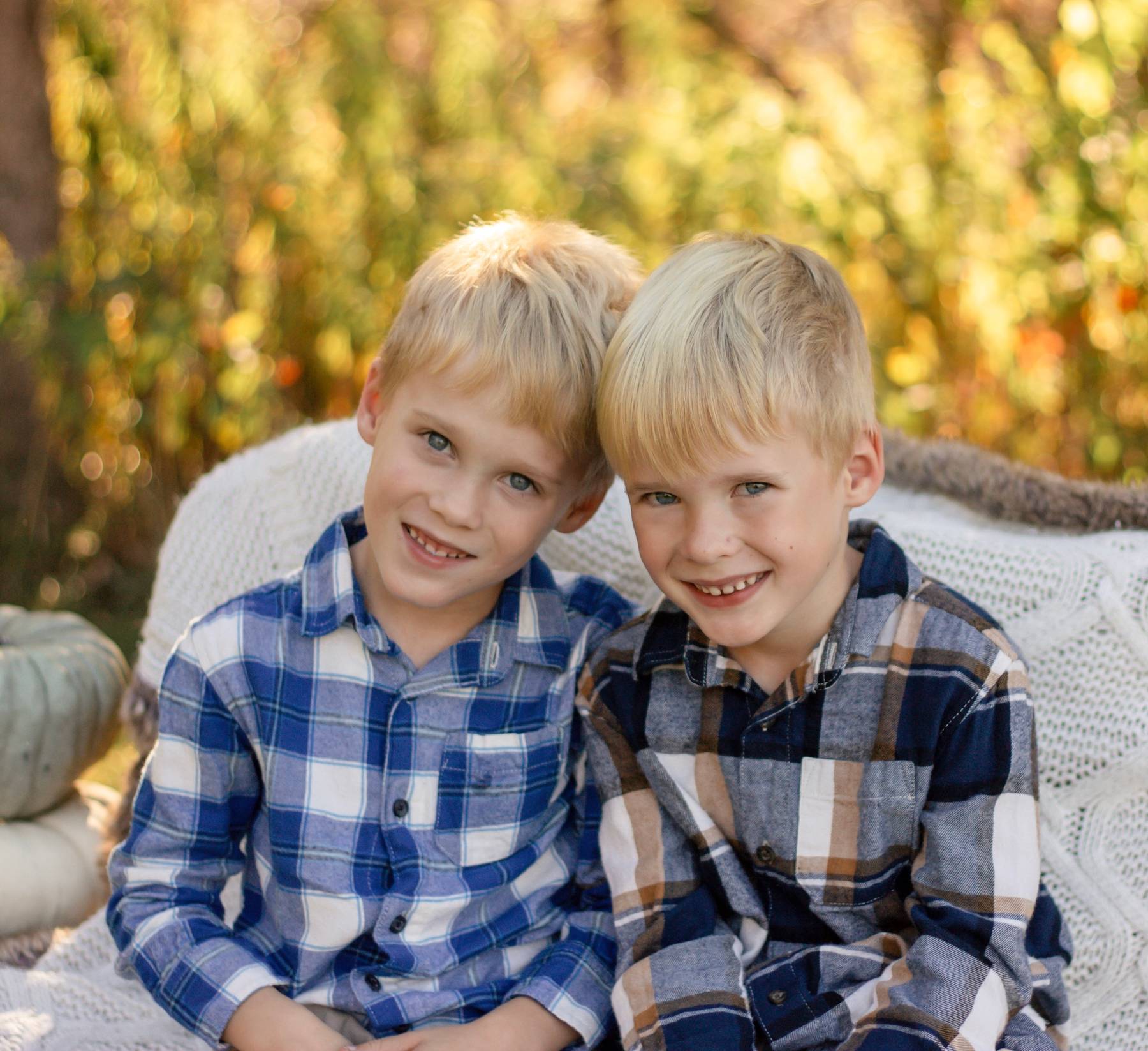 GiffordandGeorgeOctober2025 Photo of twin boys with their heads together smiling
